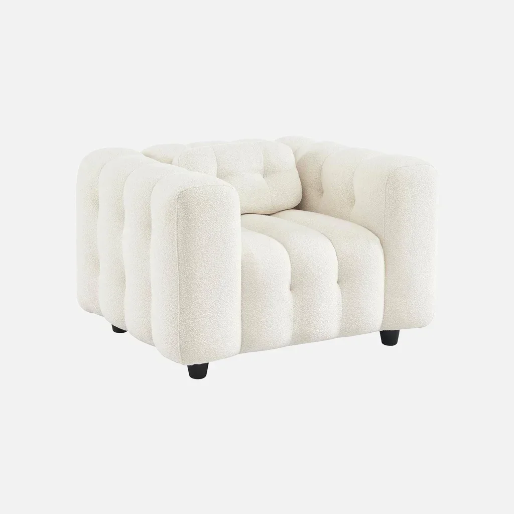 Fauteuil capitonné bouclette texturé design contemporain salon confort