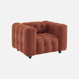 Fauteuil capitonné bouclette texturée design contemporain salon