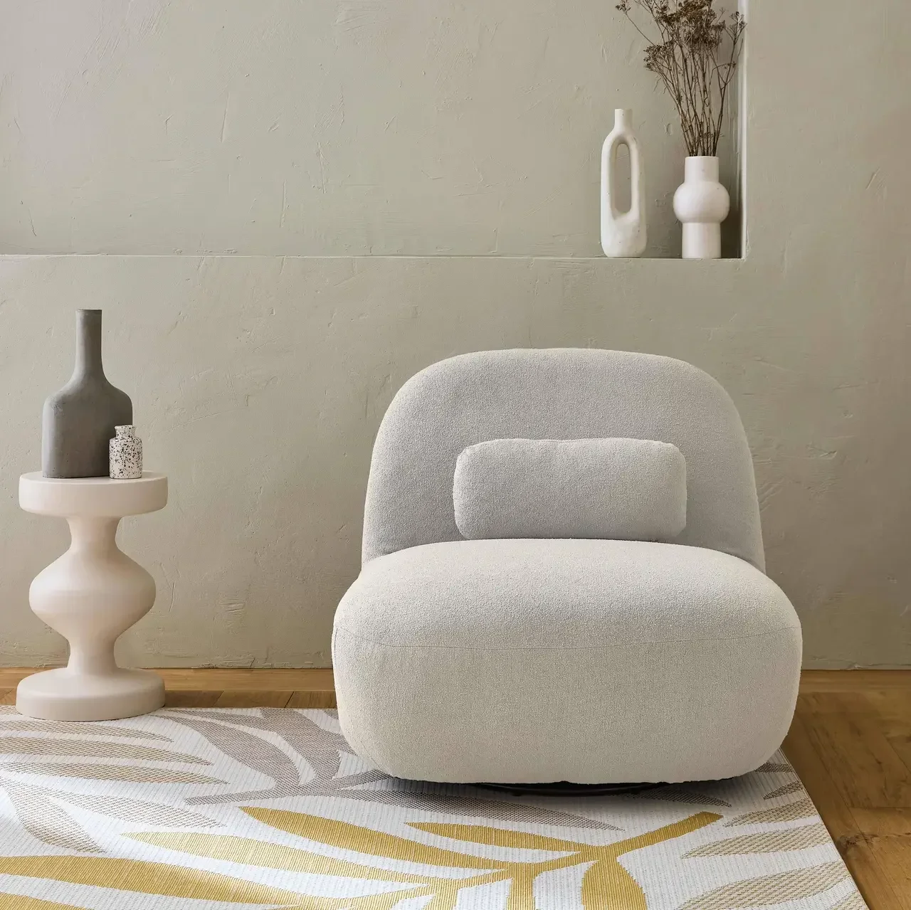 Sillón giratorio Spino gris bouclé texturizado 360° diseño contemporáneo salón