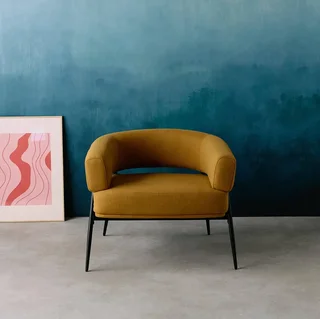 Fauteuil tissu dossier cintré piétement métallique Cristo