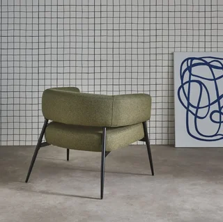 Fauteuil design Cristo tissu dossier incurvé piétement métal salon cosy