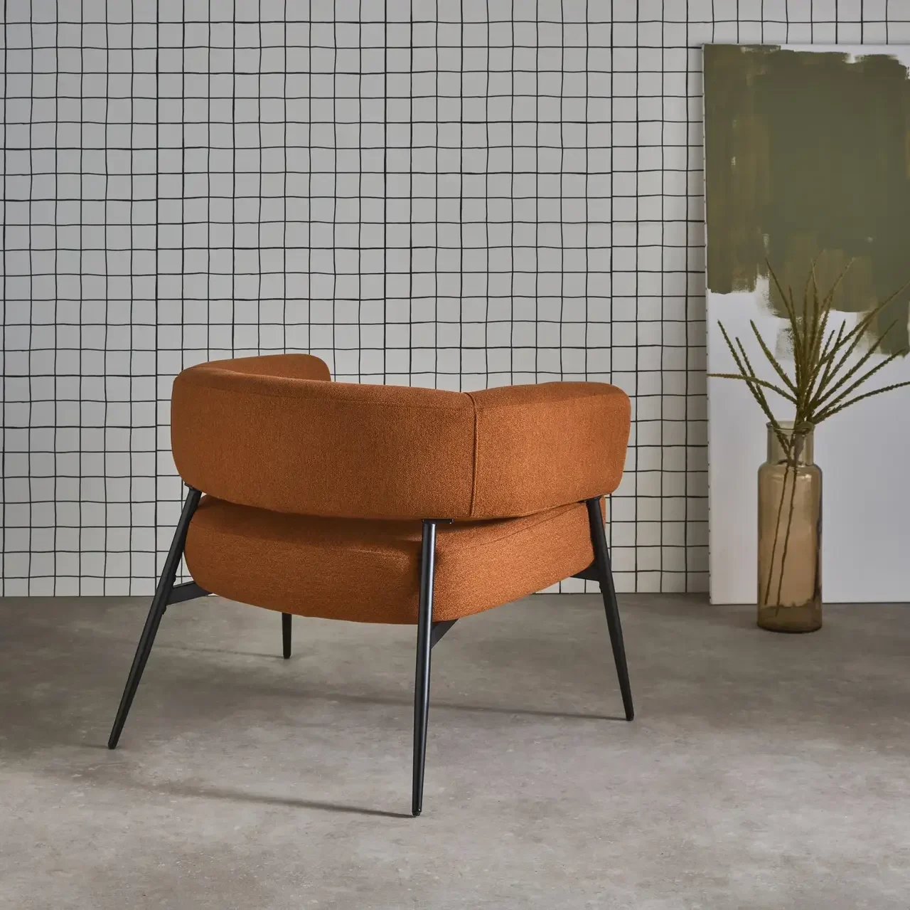 Fauteuil Cristo tissu dossier cintré piétement métallique contemporain