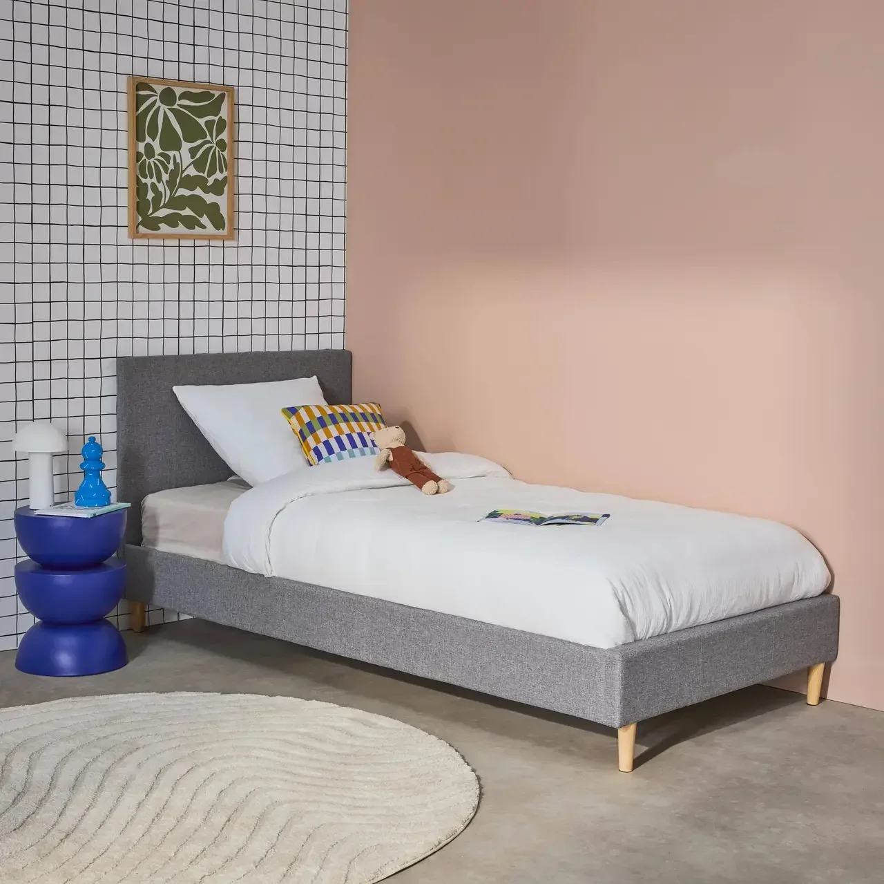 Letto 90x190 cm Marlon tessuto con rete a doghe e testiera