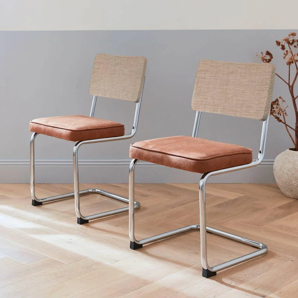 2 chaises cantilever tissu structure acier rotin vintage