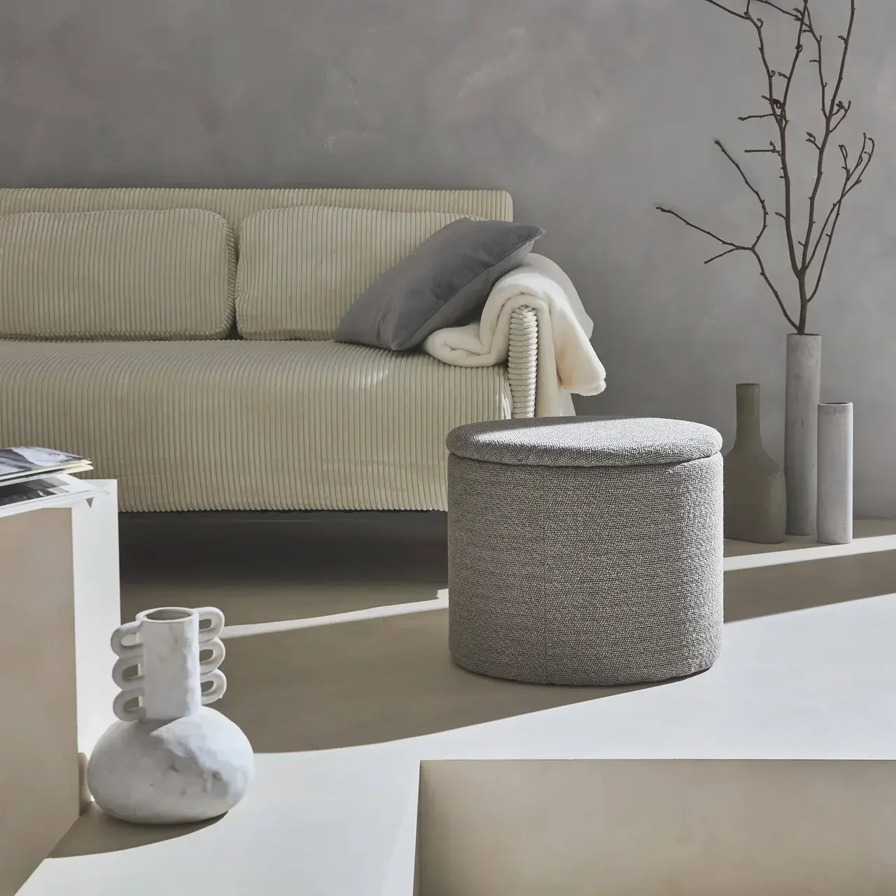 Pouf de rangement rond en tissu kaki foncé avec espace de rangement intérieur