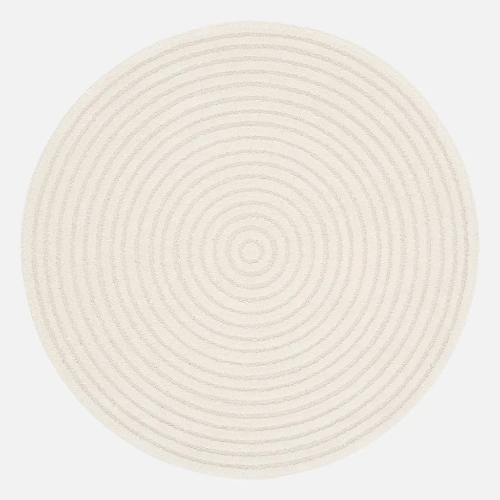 Tapis rond crème motifs circulaires relief intérieur élégant