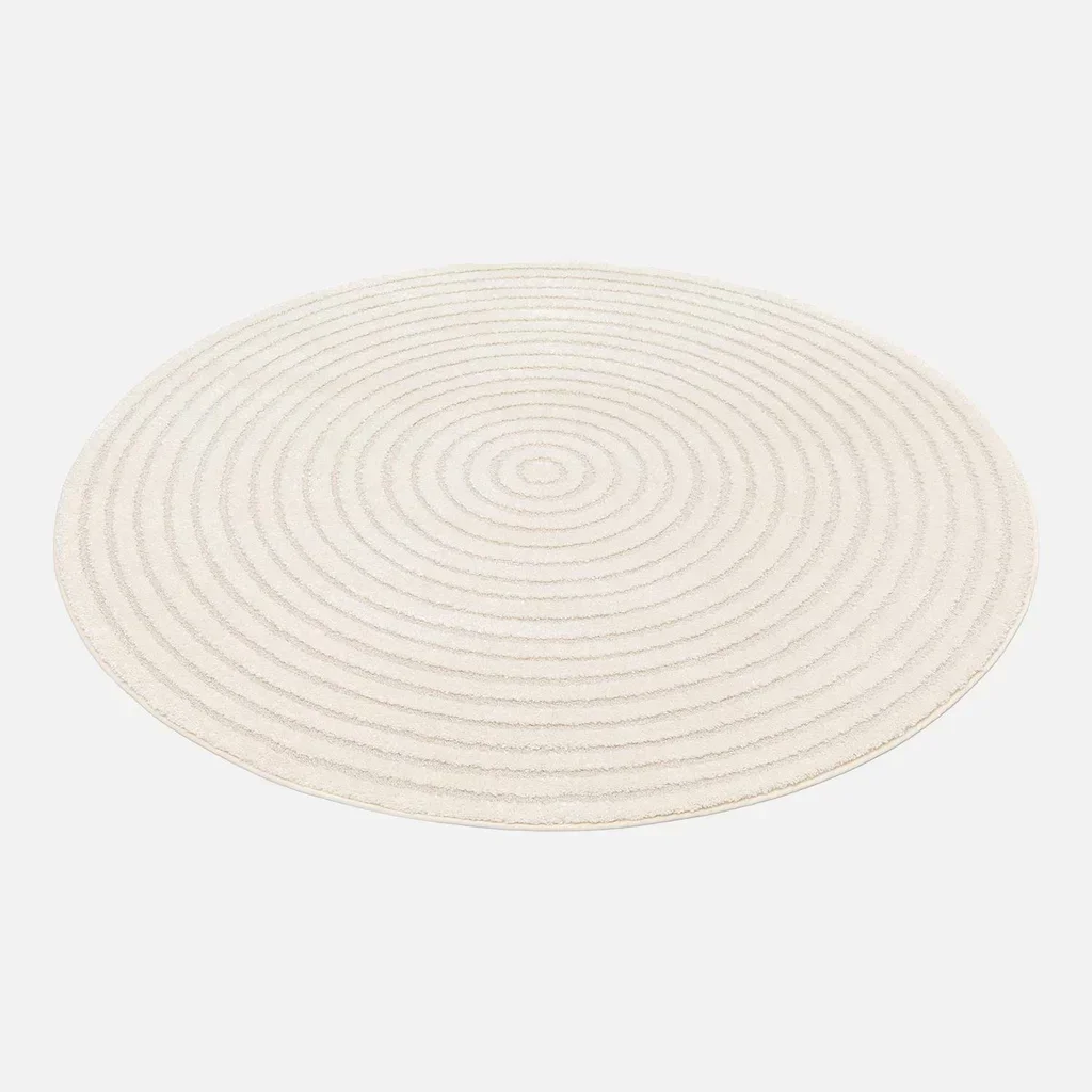Tappeto rotondo crema motivi circolari rilievo interno elegante
