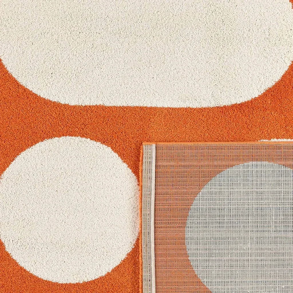 Orange living room rug long pile geometric contemporary pattern