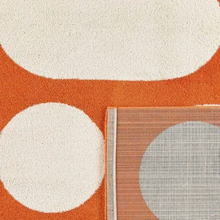 Orange living room rug geometric pattern long pile contemporary