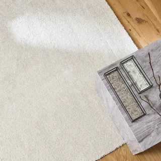 Tapis salon velours frisé crème sur mesure doux et élégant